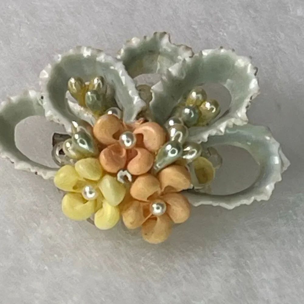 Vintage delicate floral brooch tiny shells .